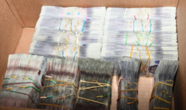 Money wrapped in elastic bands in a box