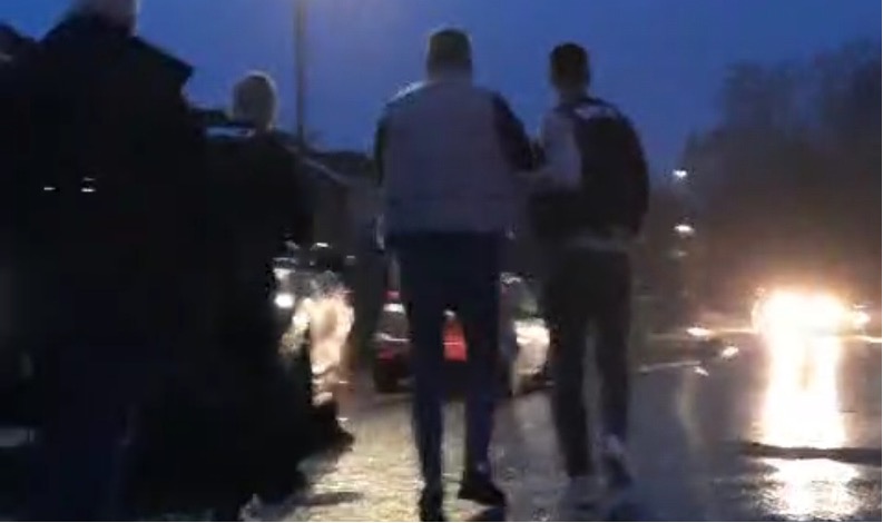 Suspect escorted by NCA officers