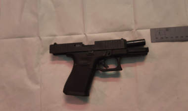 Man charged after seizure of 55 loaded handguns with hundreds of rounds of ammunition