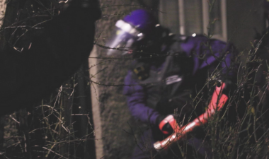 Officer forcing entry into a home