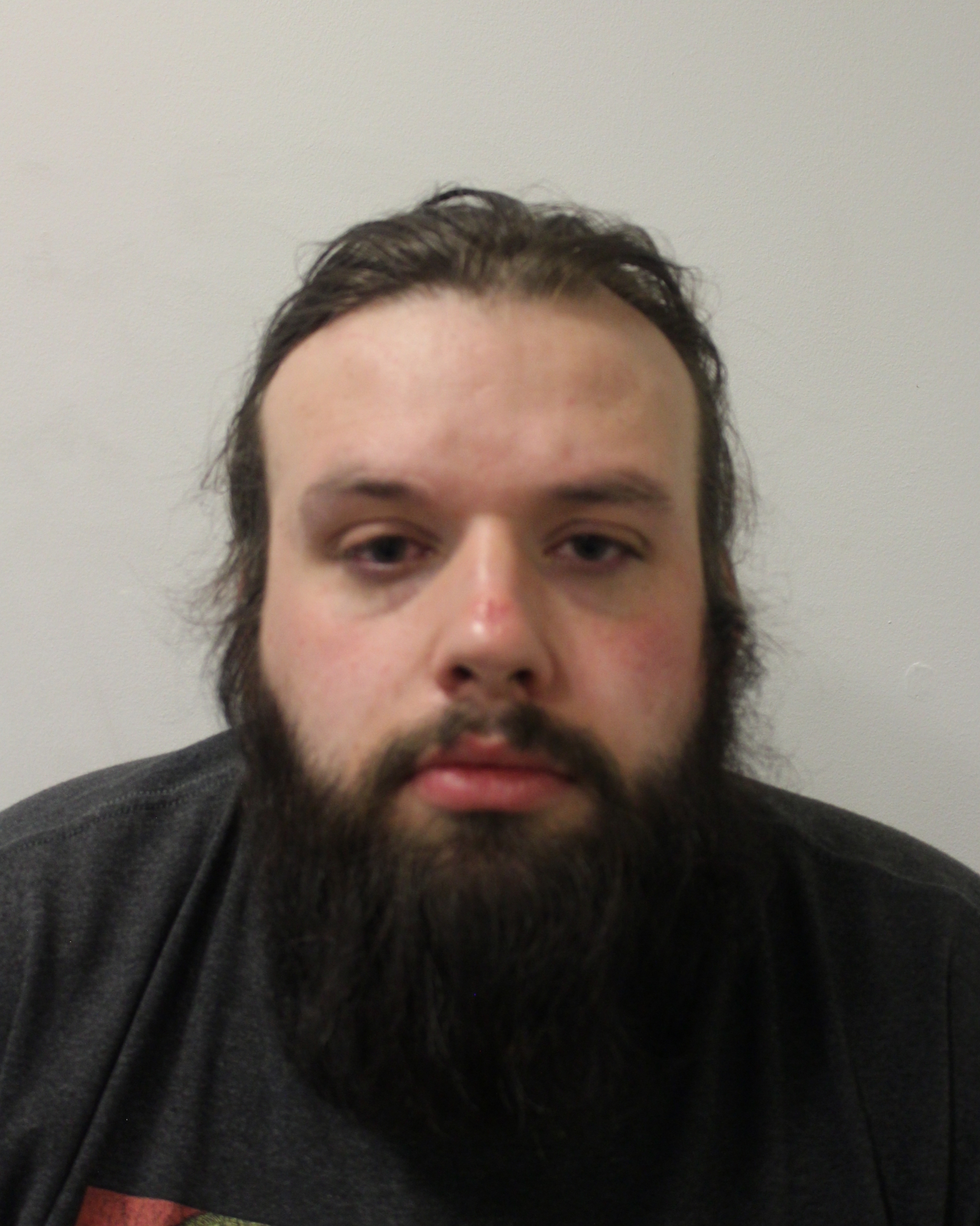 Image of Matthew Slate - a white male with brown hair and a beard in a dark t-shirt