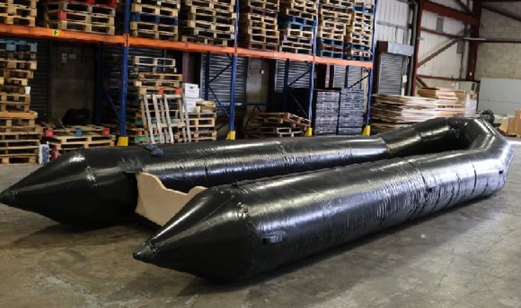 black inflated boat in a warehouse