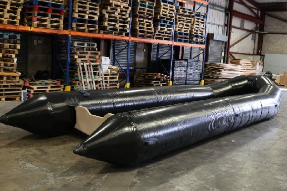 black inflated boat in a warehouse