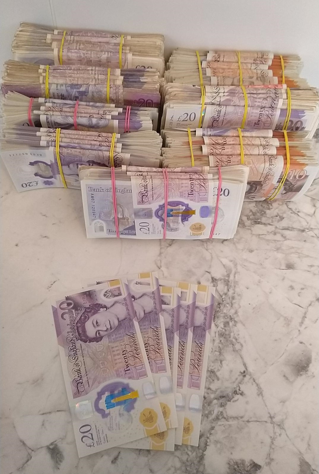 Bundles of cash with some notes spread out to show value